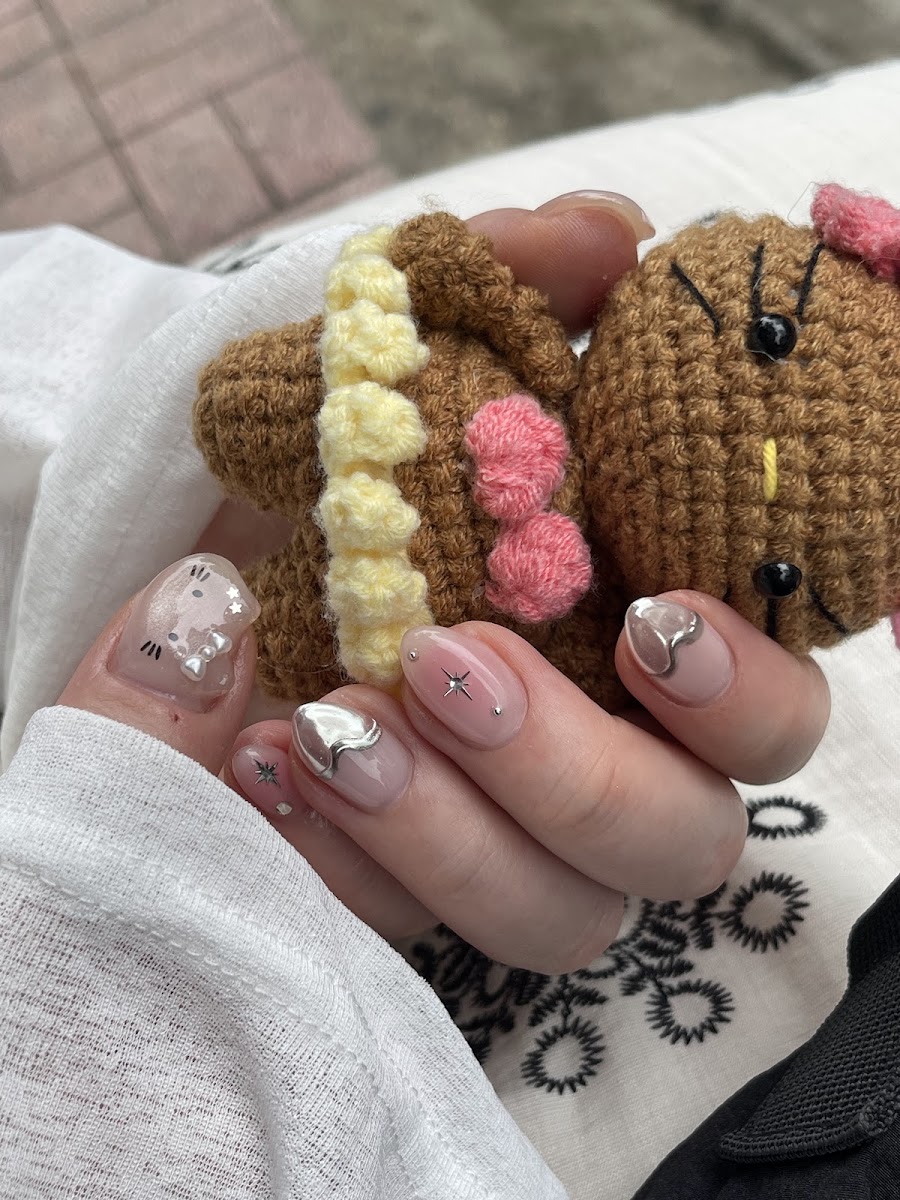 Tiny character — Niena Nails